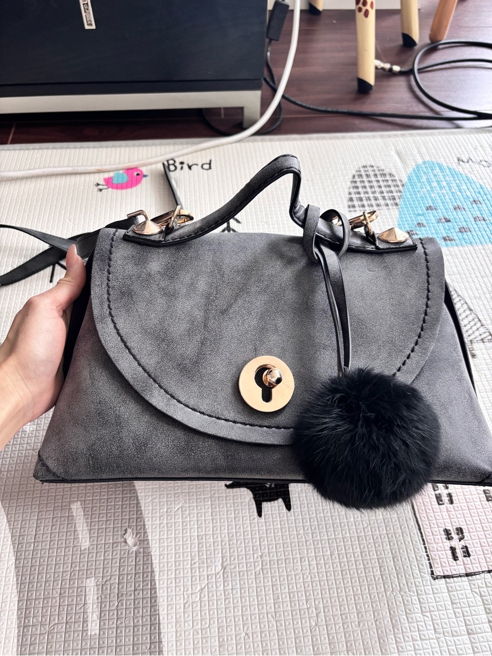 Classic Grey Suede Crossbody Bag with Pom Pom Accent